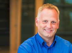 Rick Eggebrecht A man in blue shirt smiling for the camera.